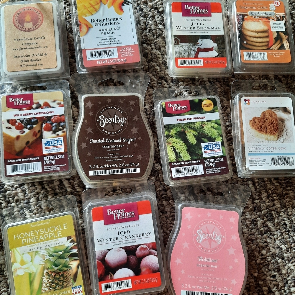 Scentsy warmer with some wax melts, tea lights, and an extra bulb.